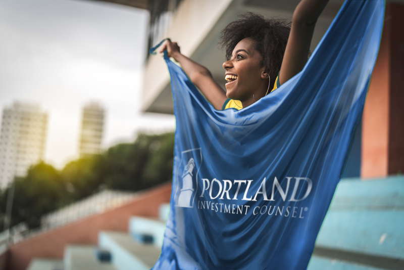 Girl with Portland Investment Counsel flag